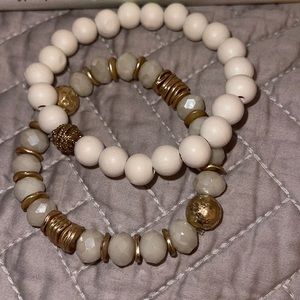 White and gold bracelets.